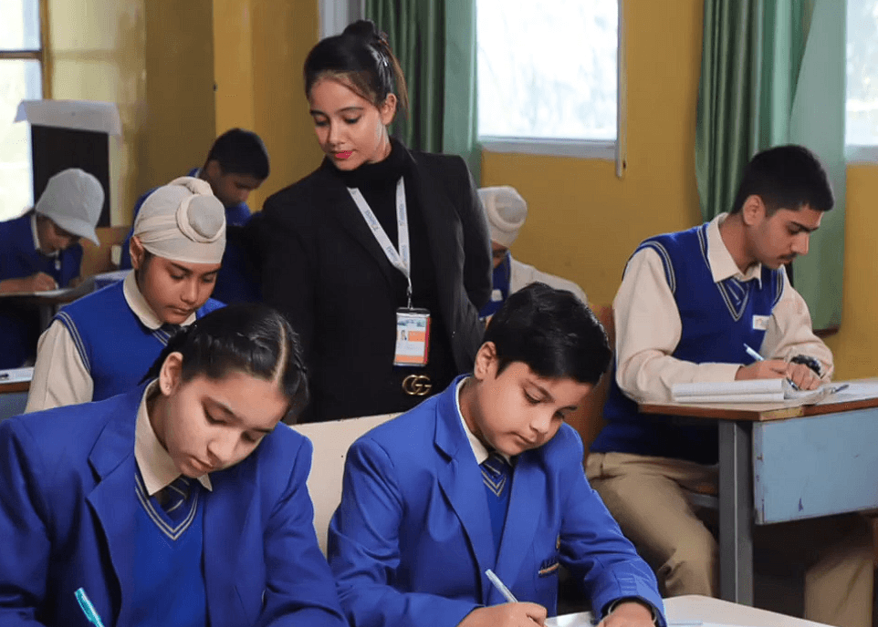 AIS teacher engaged in a classroom discussion with students