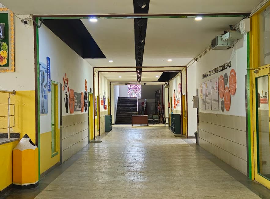 Academic block corridor lined with student display boards