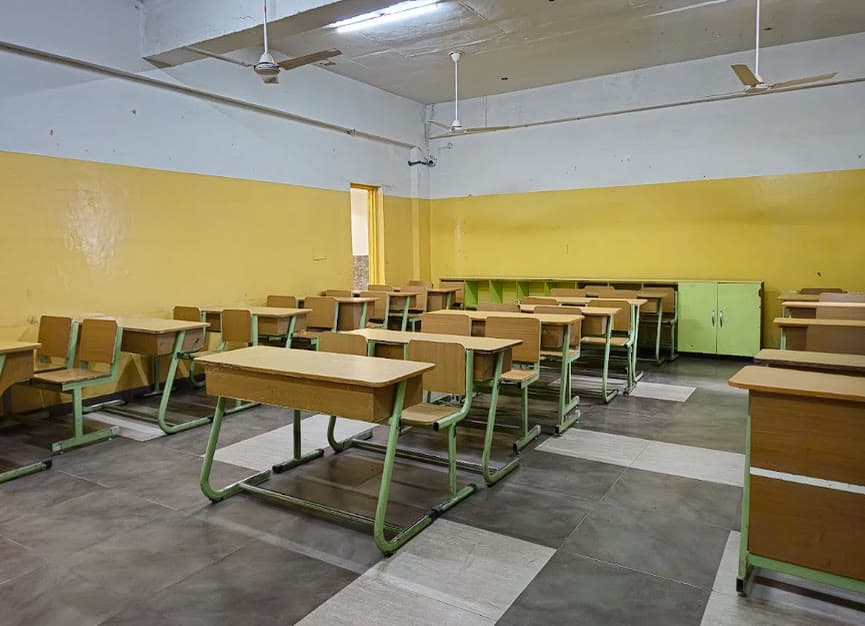 An AIS classroom — spacious, naturally lit, with individual desks