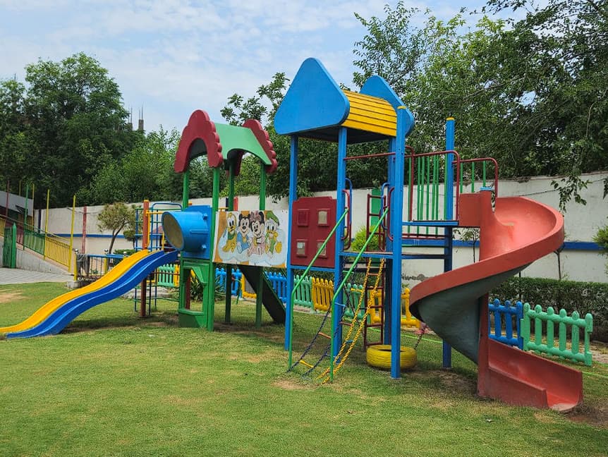 Multi-level play structure with slides and climbing nets