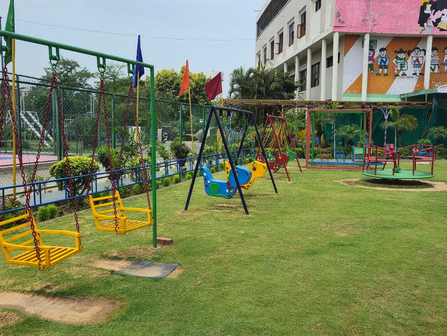 AIS early-years play area with swings and merry-go-round